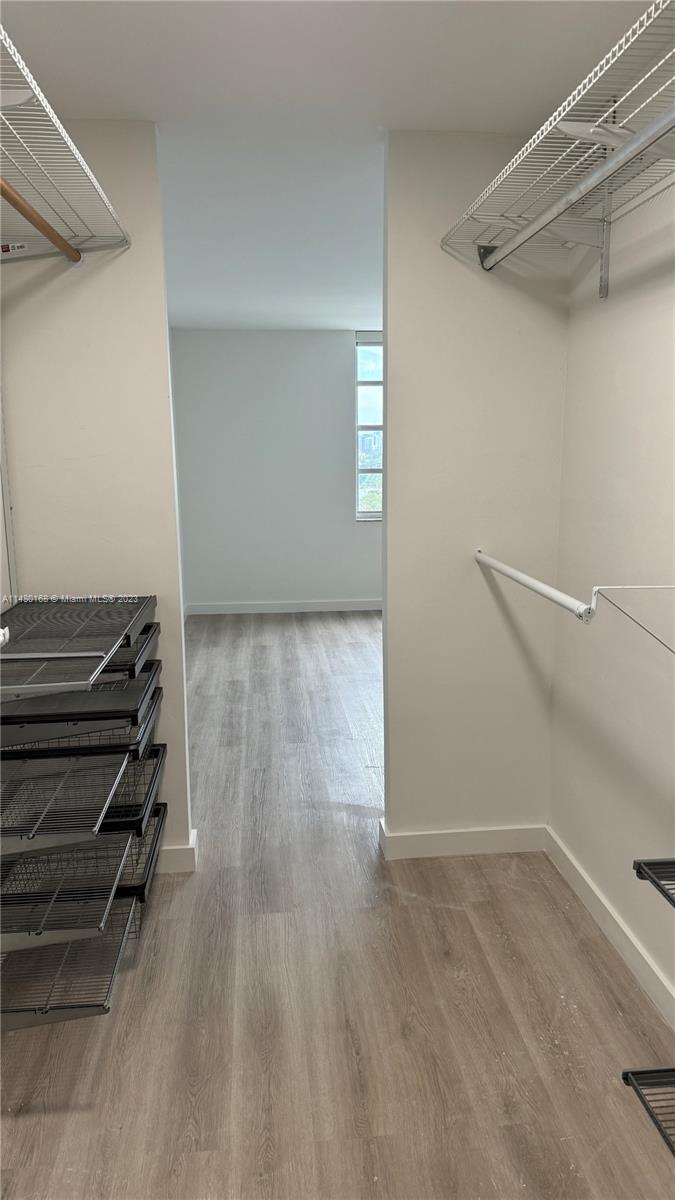 Brickell Biscayne Condominiums Miami, FL 33129 - Photo 7 of 12 a view of room with stairs and a wooden floor