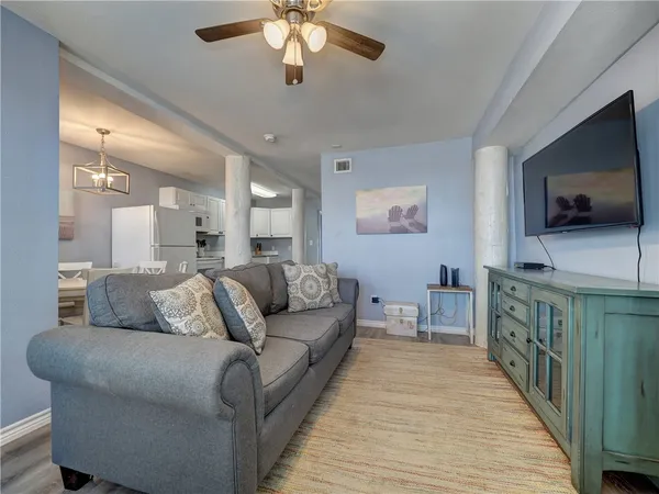 a living room with furniture and a flat screen tv