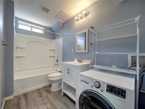 a view of bathroom with a sink toilet and shower