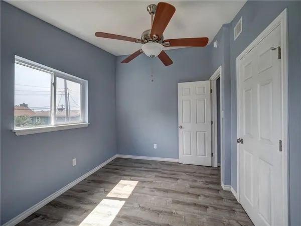 a view of an empty room and a window