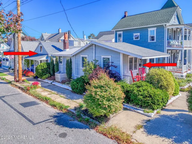 a front view of a house with a yard and fountain