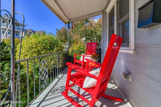 a view of a chairs and table in the balcony