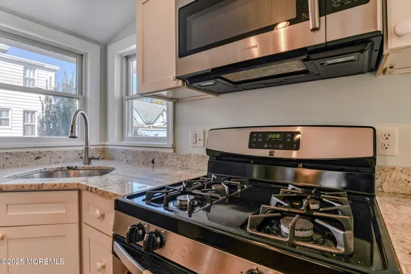 a kitchen with a stove and a sink