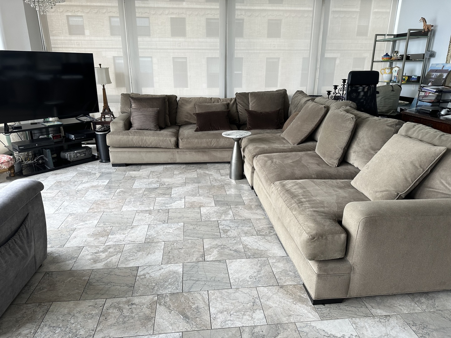 860 North Lake Shore Drive, Unit 5M Chicago, IL 60611 - Photo 7 of 11 a living room with furniture and a flat screen tv