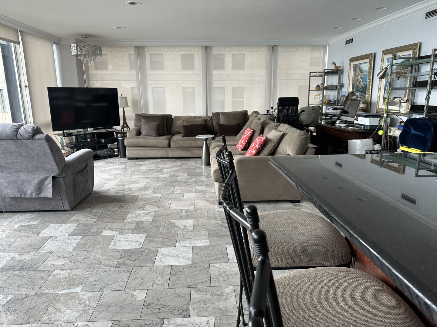 860 North Lake Shore Drive, Unit 5M Chicago, IL 60611 - Photo 8 of 11 a living room with furniture and a flat screen tv