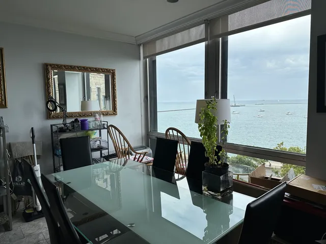 a view of a dining room with furniture window and outside view