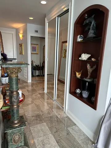 a kitchen with stainless steel appliances granite countertop a refrigerator and a stove