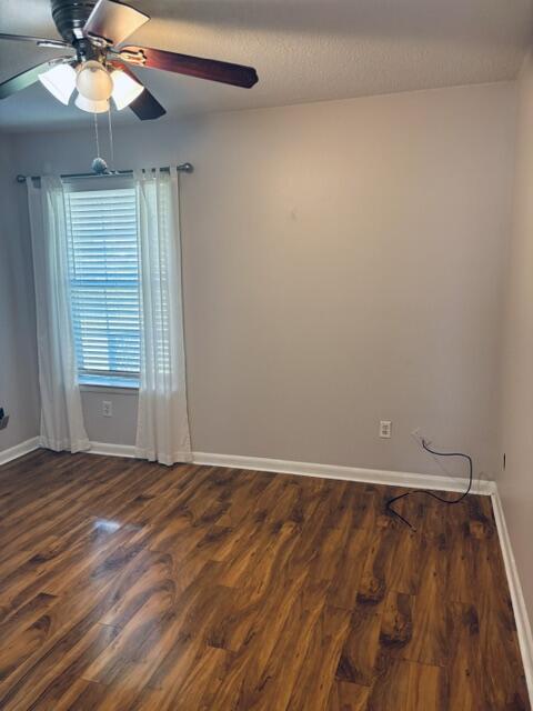 402 Juniper Street Destin, FL 32541 - Photo 15 of 20 wooden floor in an empty room with a window