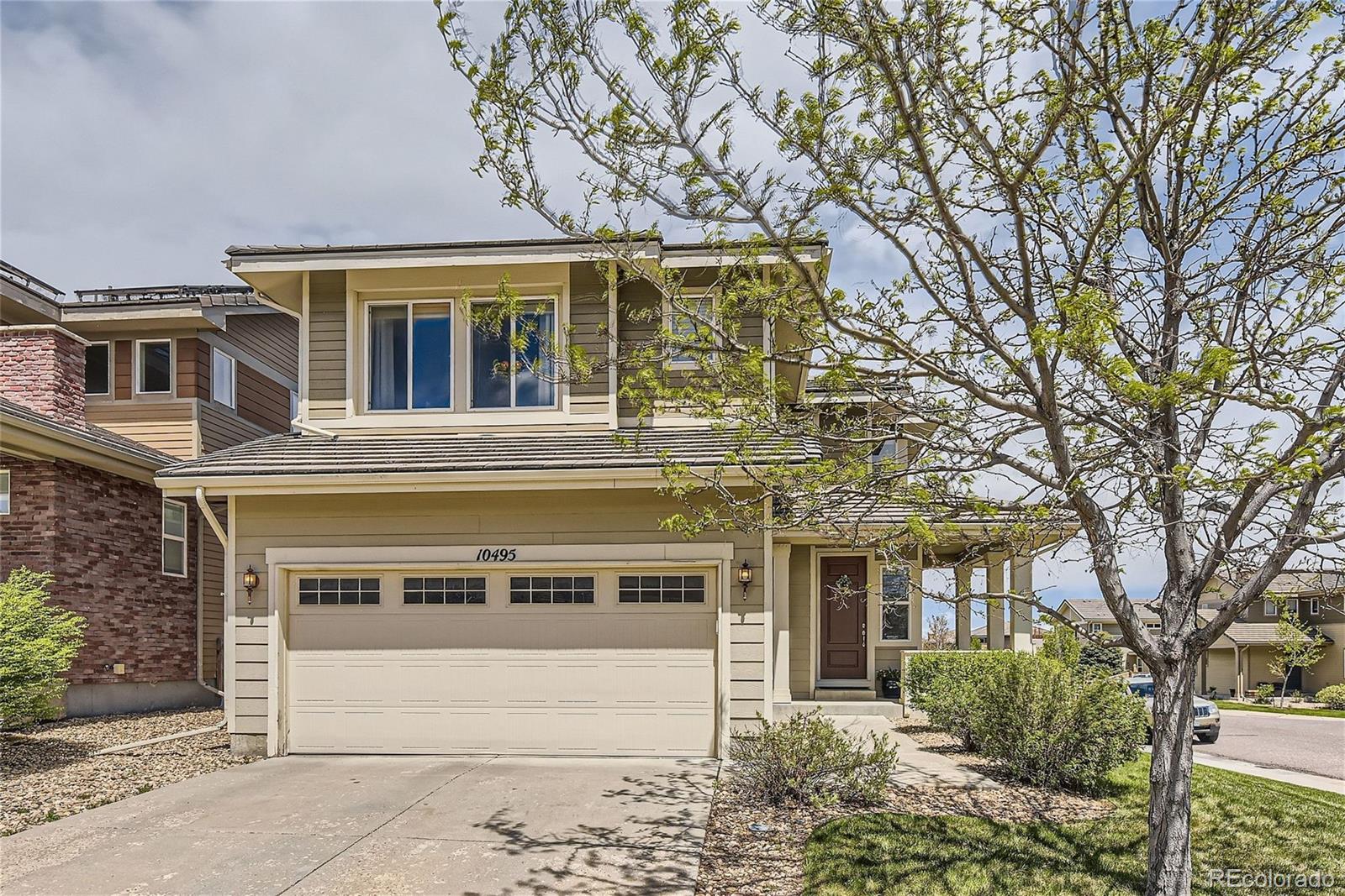 10495 Rutledge Street Parker, CO 80134 - Photo 1 of 32 front view of a house with a yard