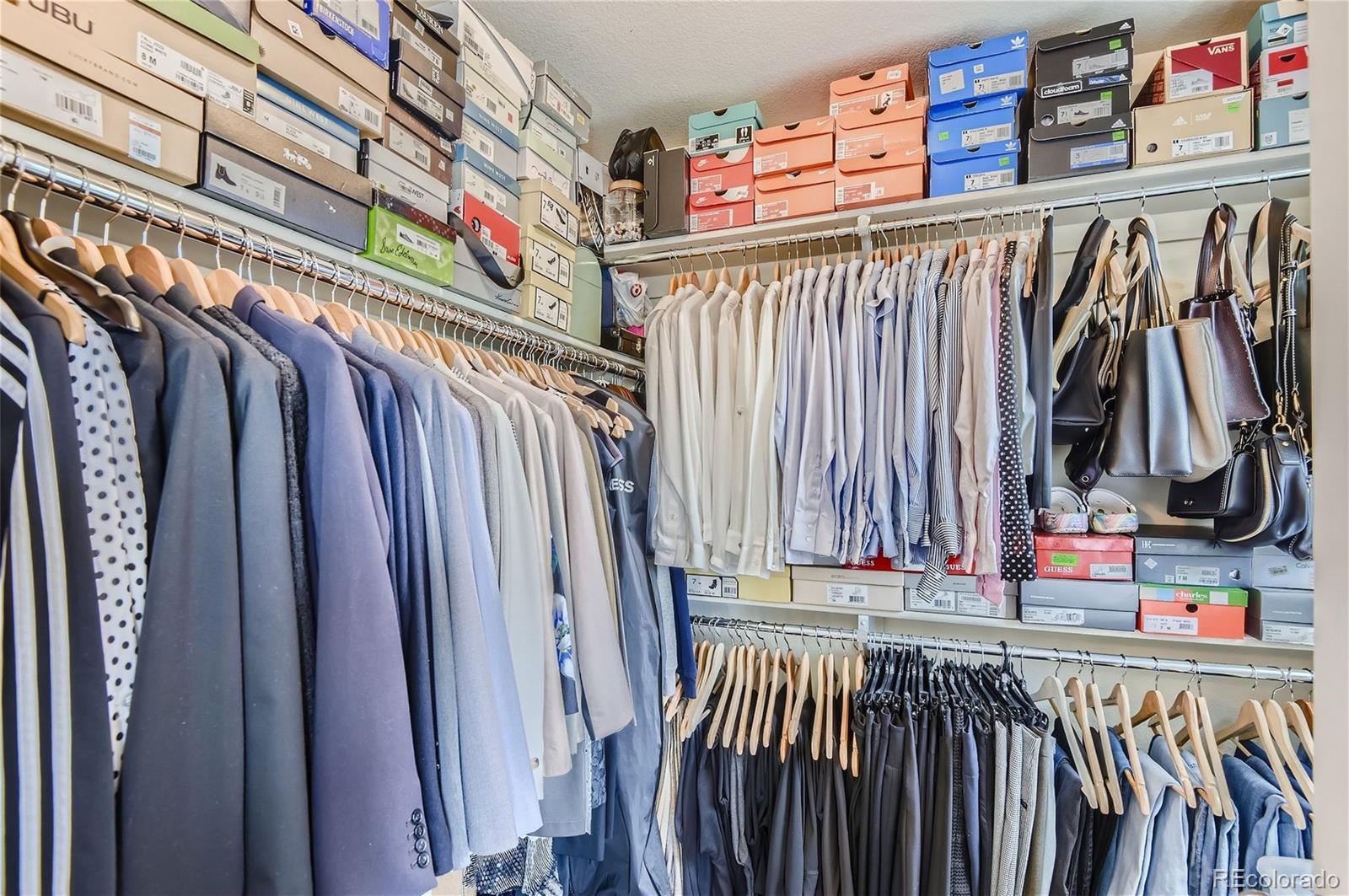 10495 Rutledge Street Parker, CO 80134 - Photo 15 of 32 a view of walk in closet with clothes