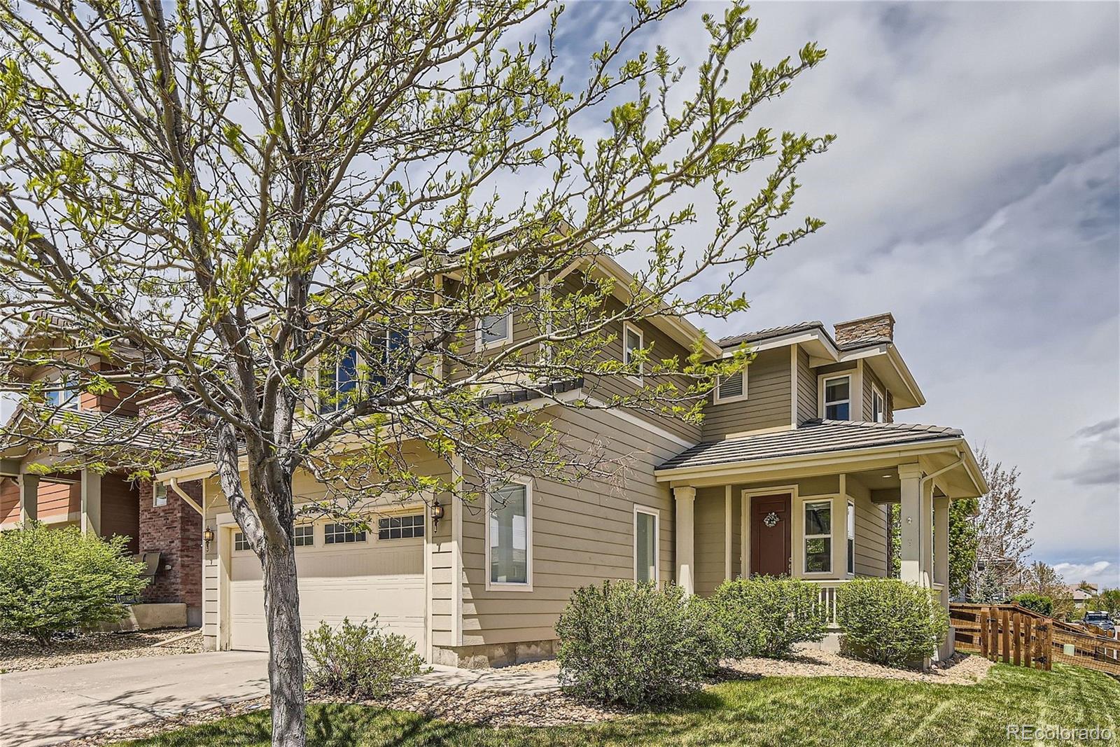 10495 Rutledge Street Parker, CO 80134 - Photo 2 of 32 front view of a house with a yard