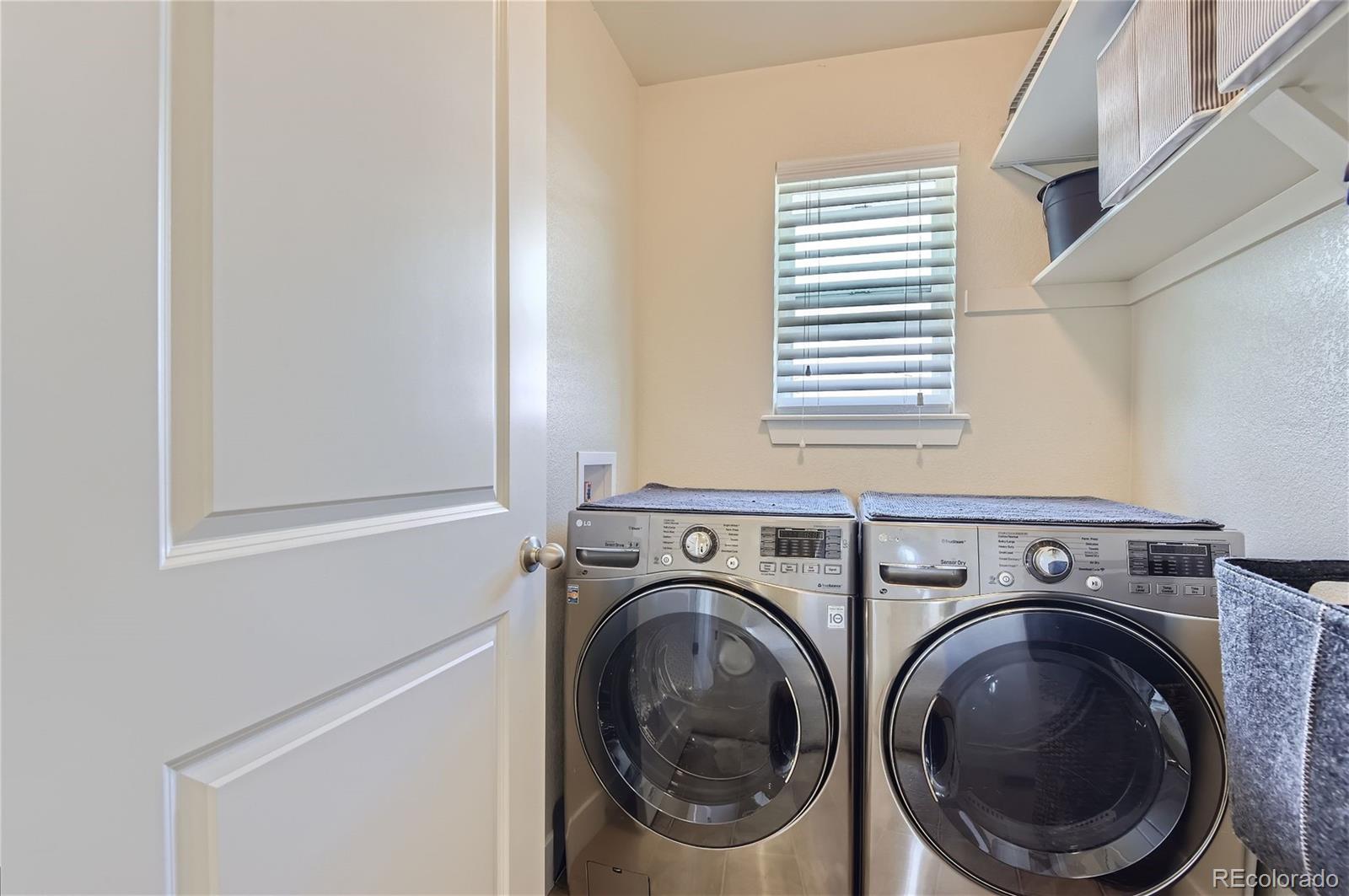 10495 Rutledge Street Parker, CO 80134 - Photo 21 of 32 a utility room with dryer and washer