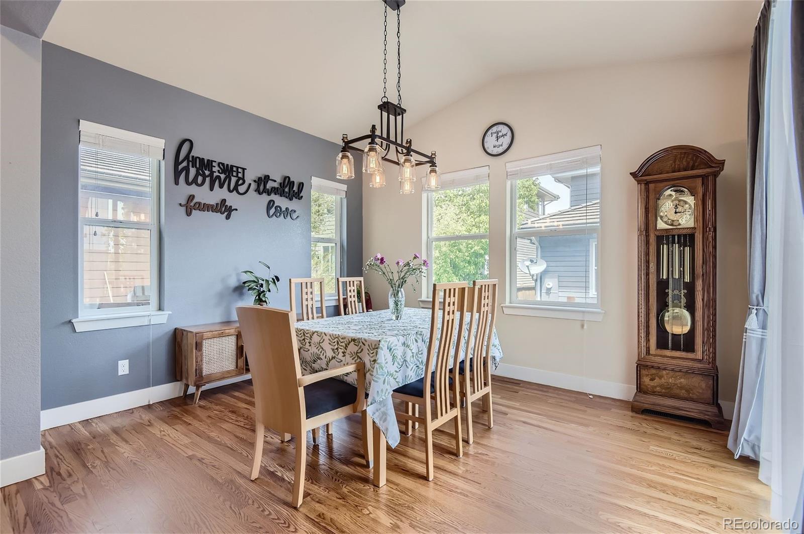 10495 Rutledge Street Parker, CO 80134 - Photo 10 of 32 a view of a dining room with furniture window and wooden floor