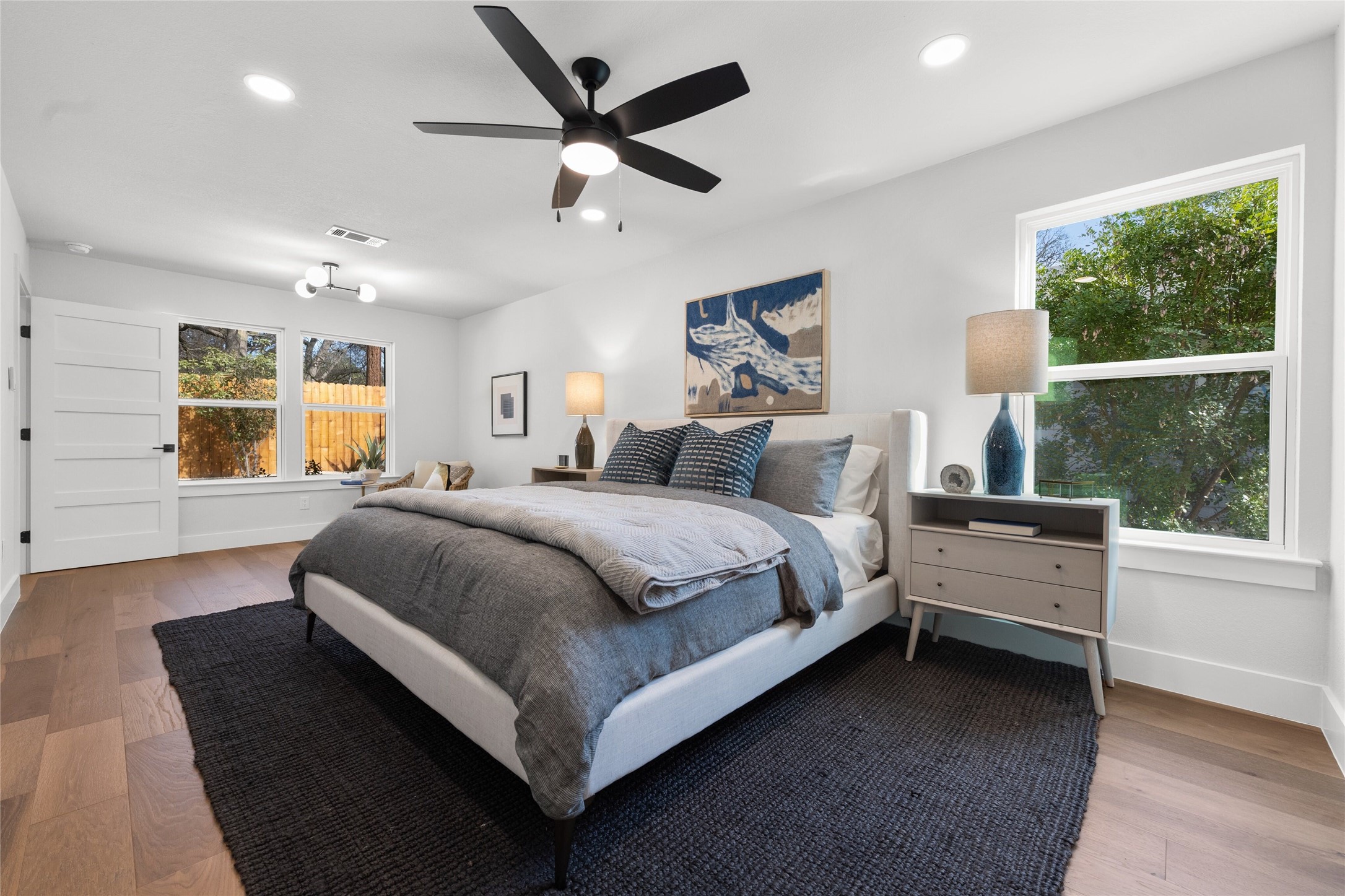 2404 Monarch Drive Austin, TX 78748 - Photo 15 of 25 a bedroom with a large bed and a large window