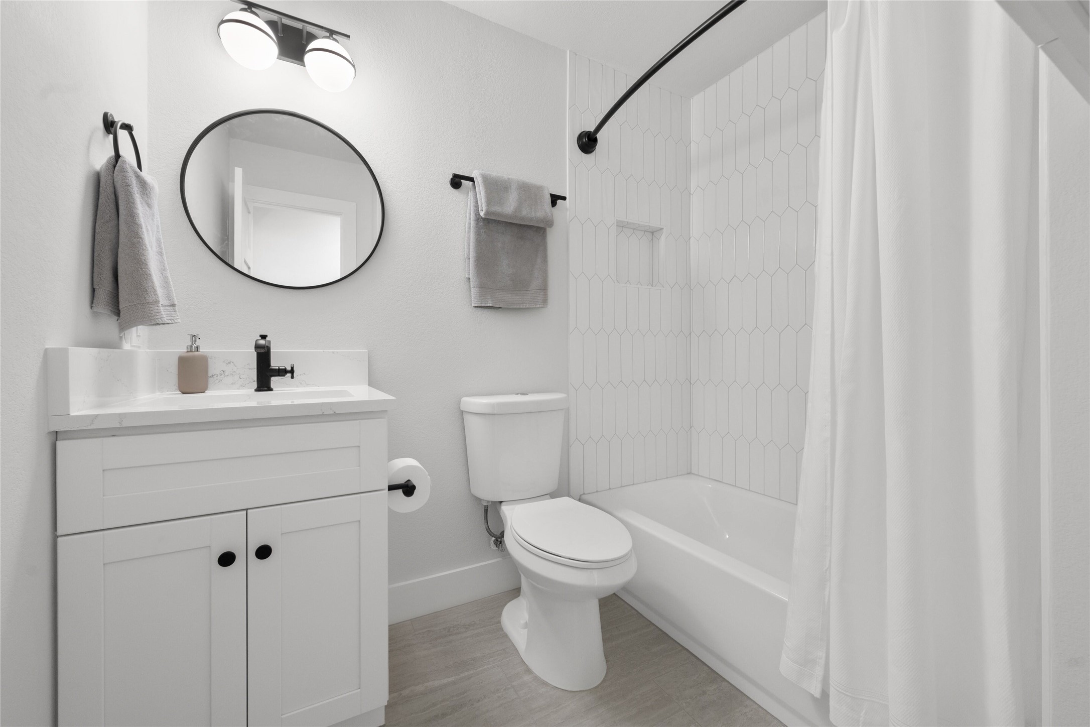 2404 Monarch Drive Austin, TX 78748 - Photo 19 of 25 a bathroom with a toilet a sink and a mirror