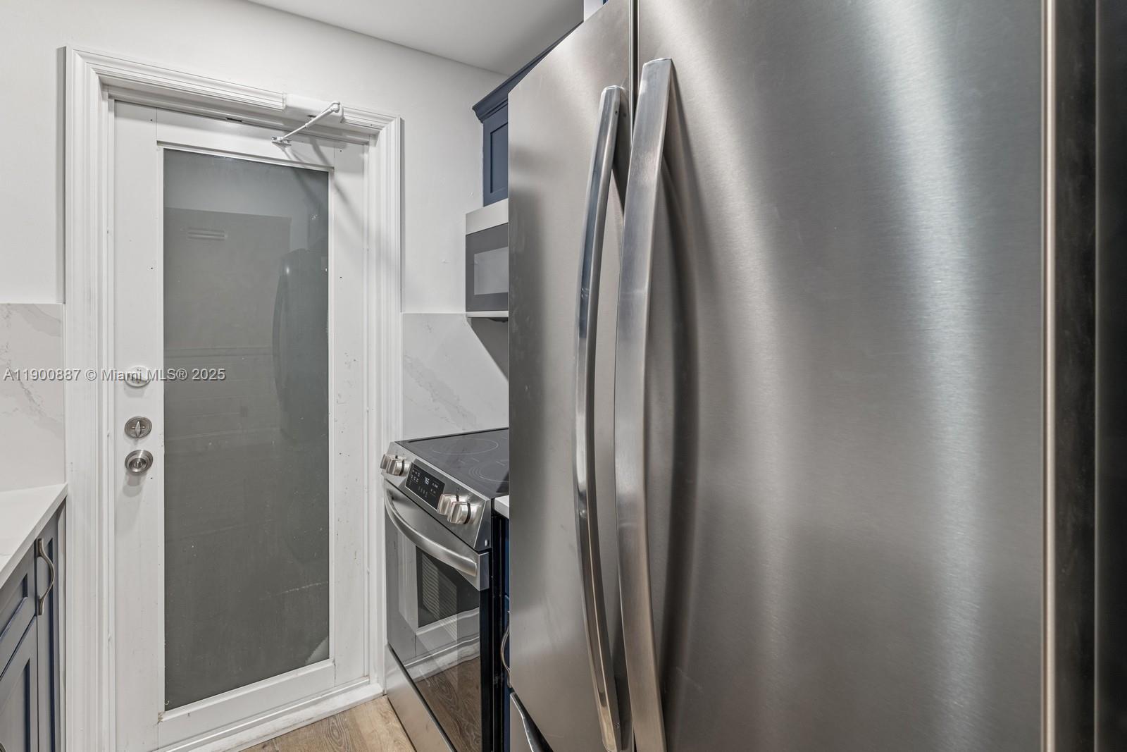 255 Sunrise Drive, Unit 107 Key Biscayne, FL 33149 - Photo 14 of 18 a close view of a faucet and cabinets