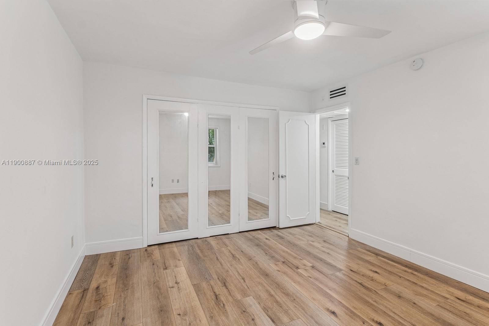255 Sunrise Drive, Unit 107 Key Biscayne, FL 33149 - Photo 17 of 18 wooden floor in an empty room