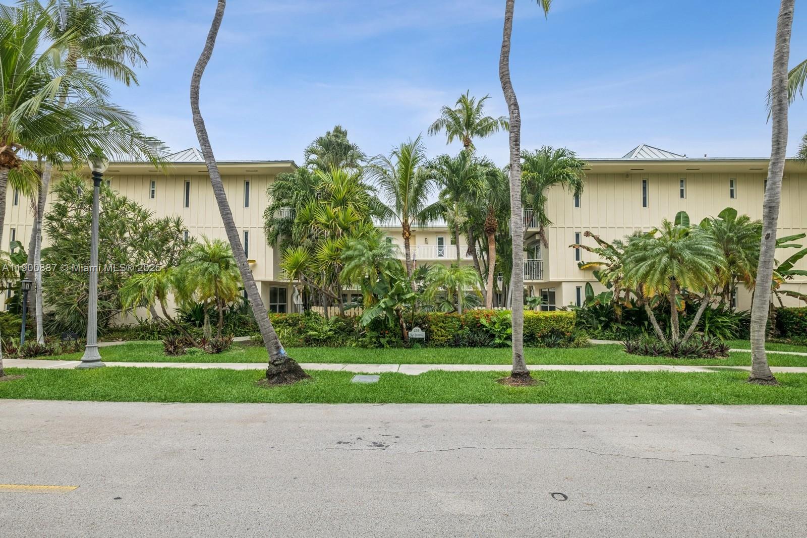255 Sunrise Drive, Unit 107 Key Biscayne, FL 33149 - Photo 2 of 18 a house with garden in front of it