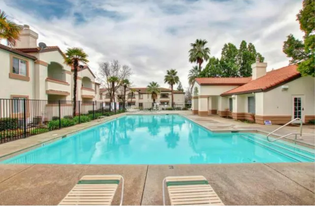 a view of a swimming pool with a lounge chairs
