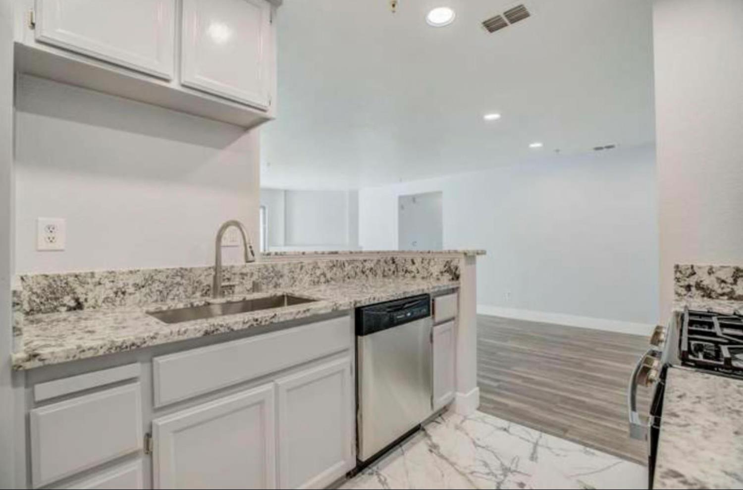 8020 Walerga Road, Unit 1147 Antelope, CA 95843 - Photo 5 of 20 a kitchen with a sink and cabinets
