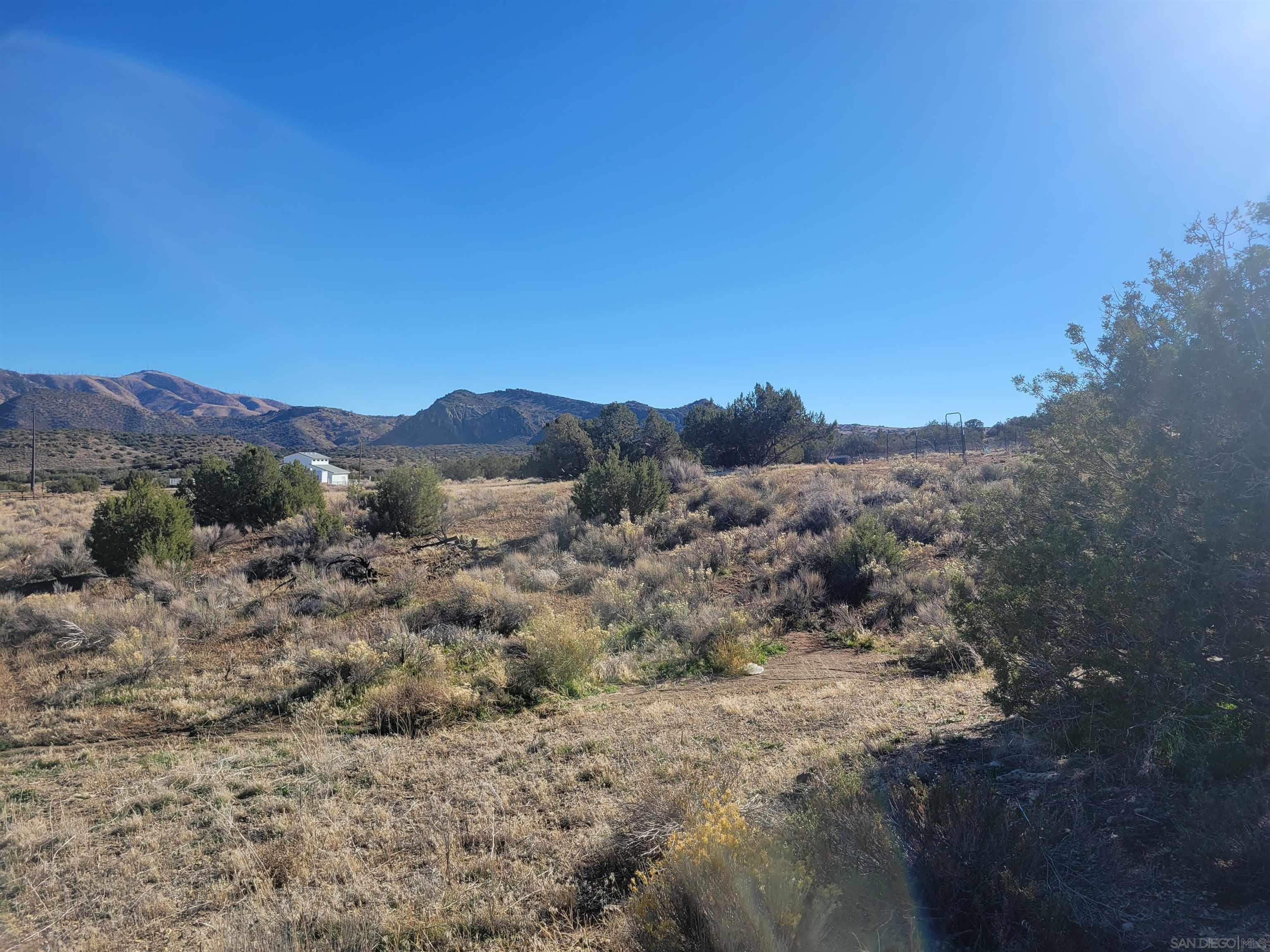 0 Inyanga Road Tehachapi, CA 93561 - Photo 6 of 6 a view of a mountain range with trees in the background
