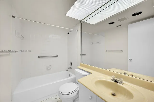 a close view of a utility room with dryer and washer