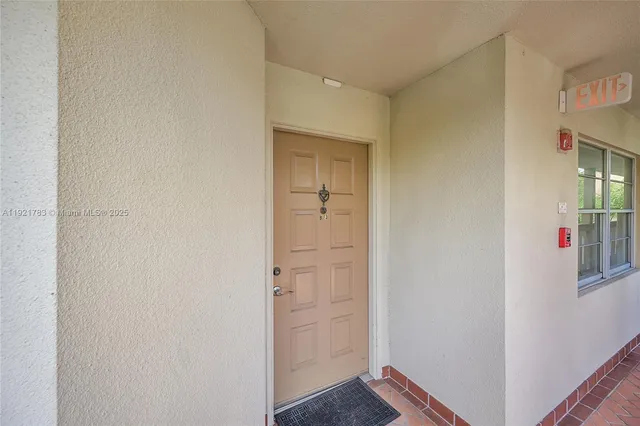 a view of a kitchen from the hallway