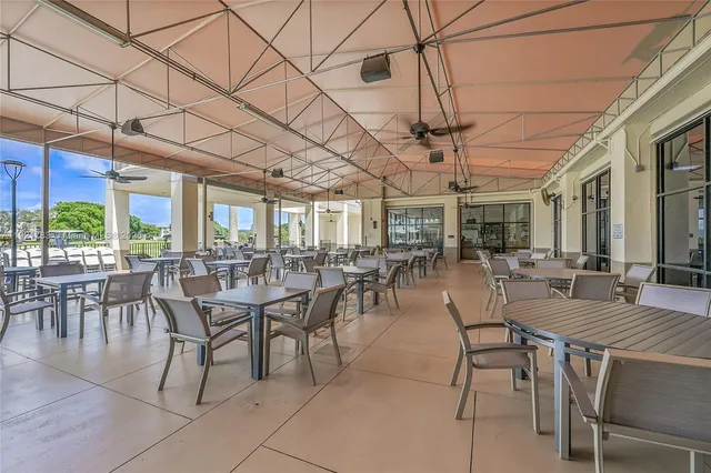 a room with furniture and pool table