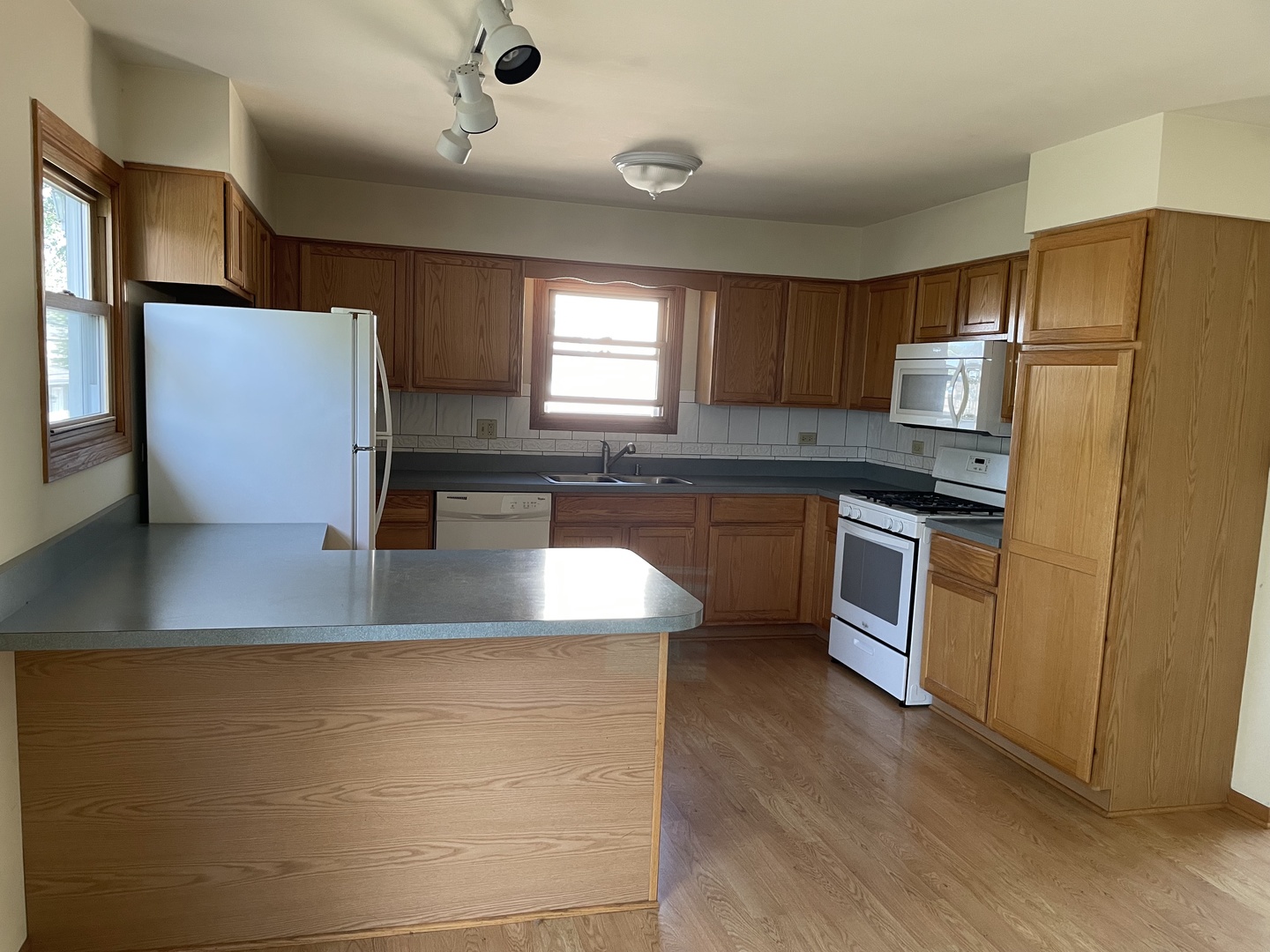 5648 Dover Road Oak Forest, IL 60452 - Photo 4 of 9 a kitchen with stainless steel appliances granite countertop a refrigerator a sink a stove a microwave and island
