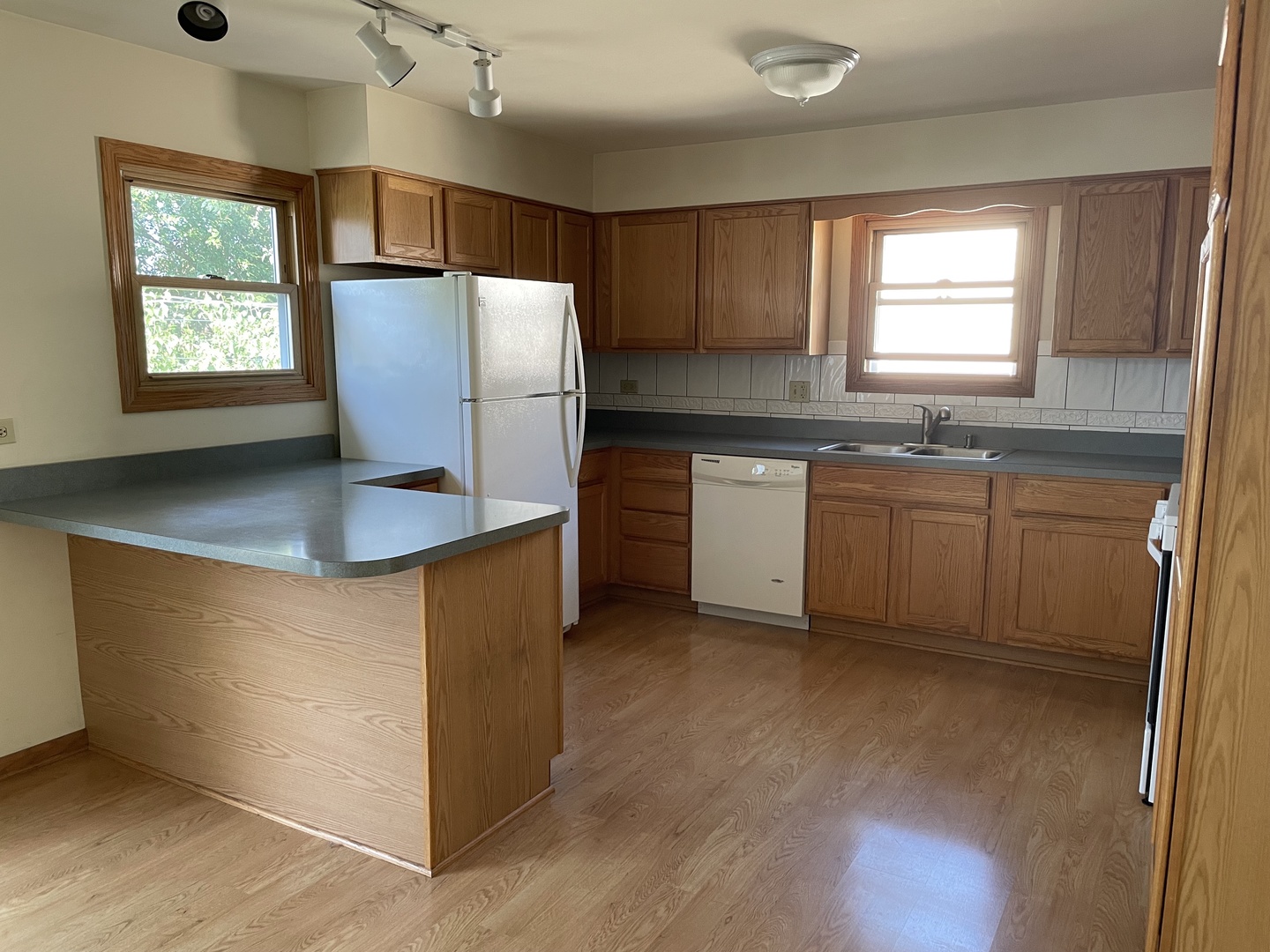 5648 Dover Road Oak Forest, IL 60452 - Photo 5 of 9 a kitchen with stainless steel appliances granite countertop a refrigerator a sink a stove a microwave a counter space and cabinets