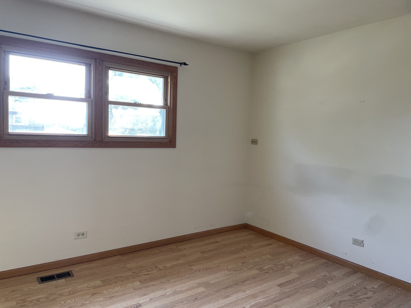 5648 Dover Road Oak Forest, IL 60452 - Photo 6 of 9 an empty room with wooden floor and windows