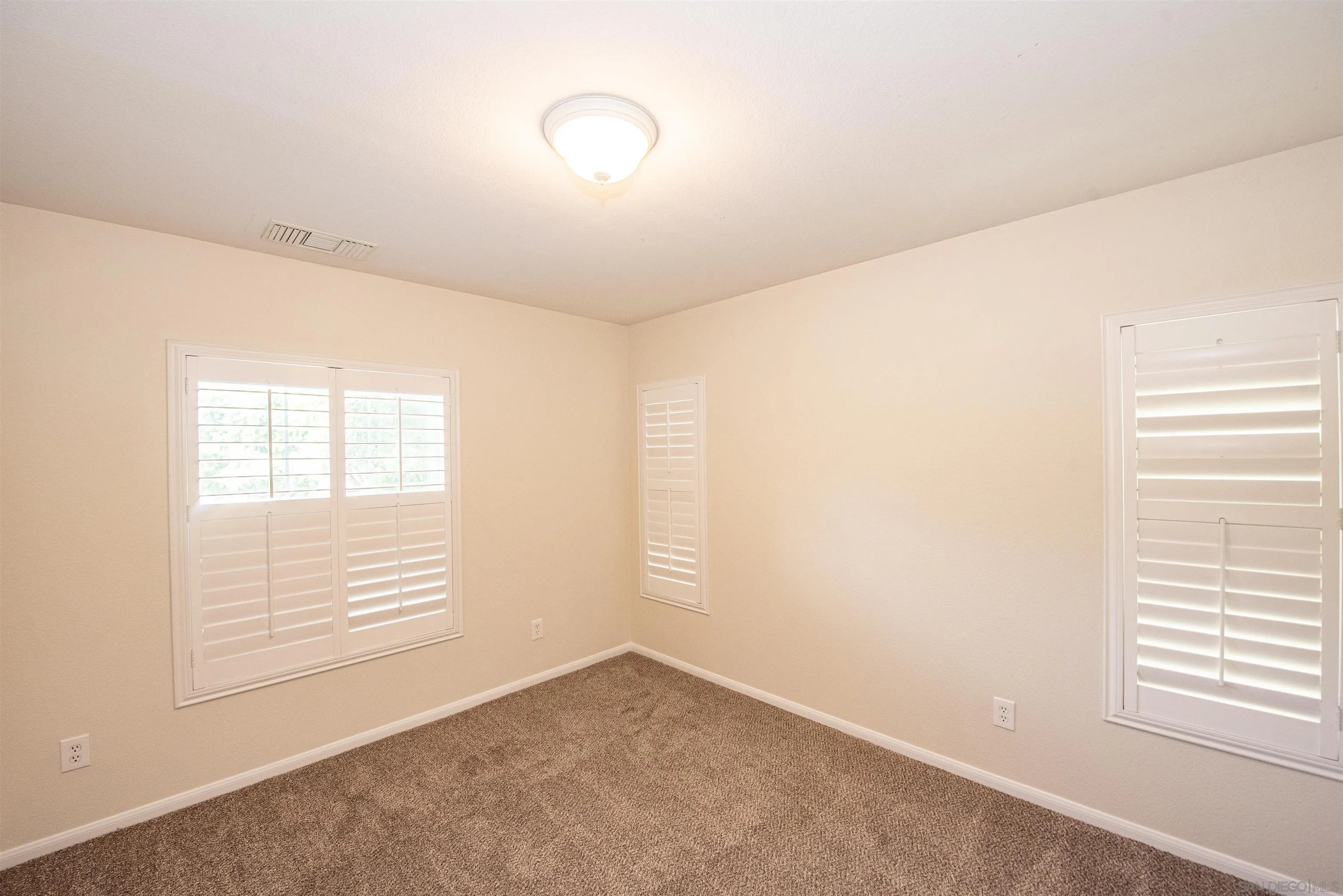 1602 Saddle Ridge Drive Chula Vista, CA 91915 - Photo 12 of 34 an empty room with windows