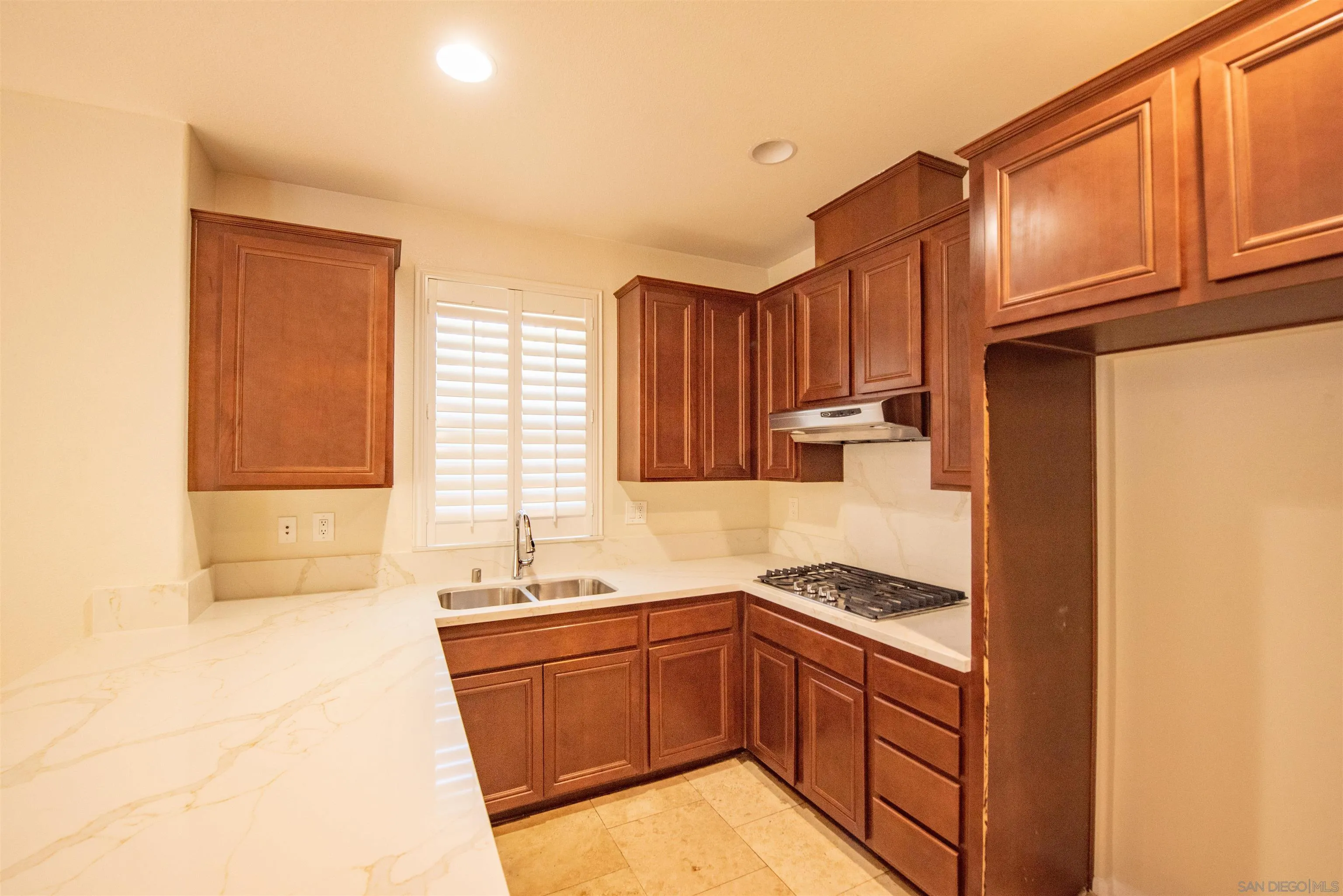 1602 Saddle Ridge Drive Chula Vista, CA 91915 - Photo 2 of 34 a kitchen with stainless steel appliances granite countertop a sink stove and refrigerator