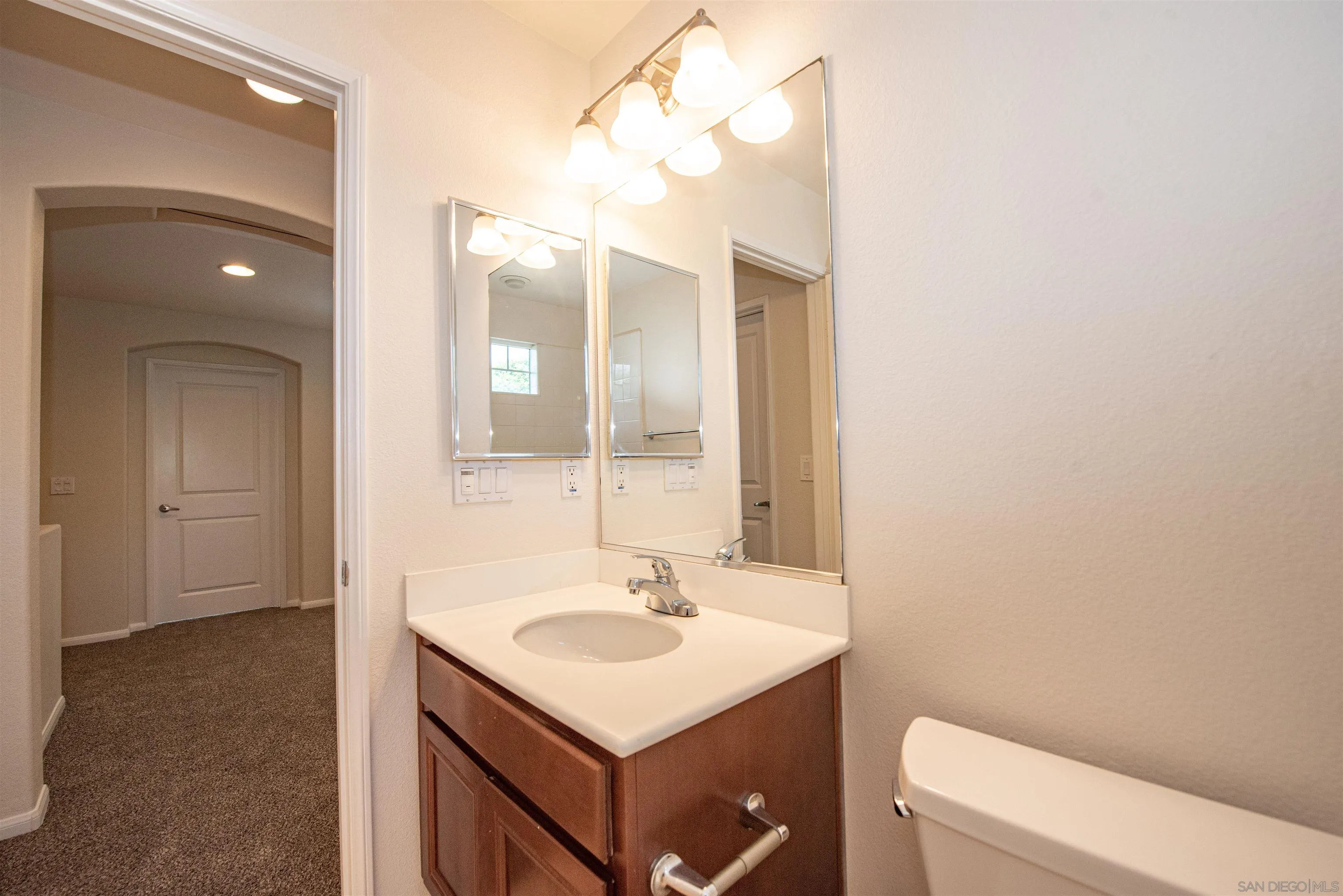 1602 Saddle Ridge Drive Chula Vista, CA 91915 - Photo 24 of 34 a bathroom with a sink and a mirror
