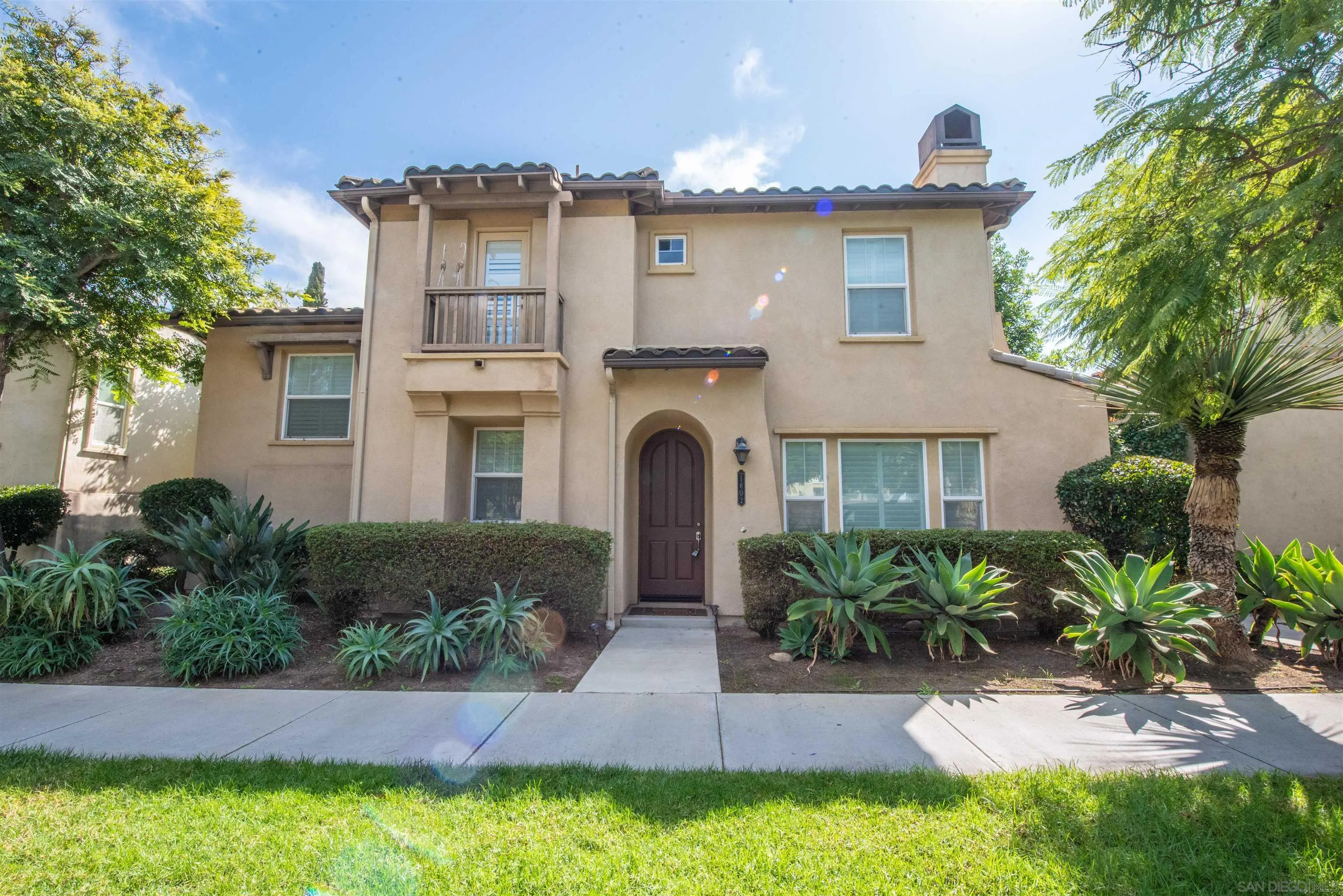 1602 Saddle Ridge Drive Chula Vista, CA 91915 - Photo 29 of 34 a front view of a house with a yard