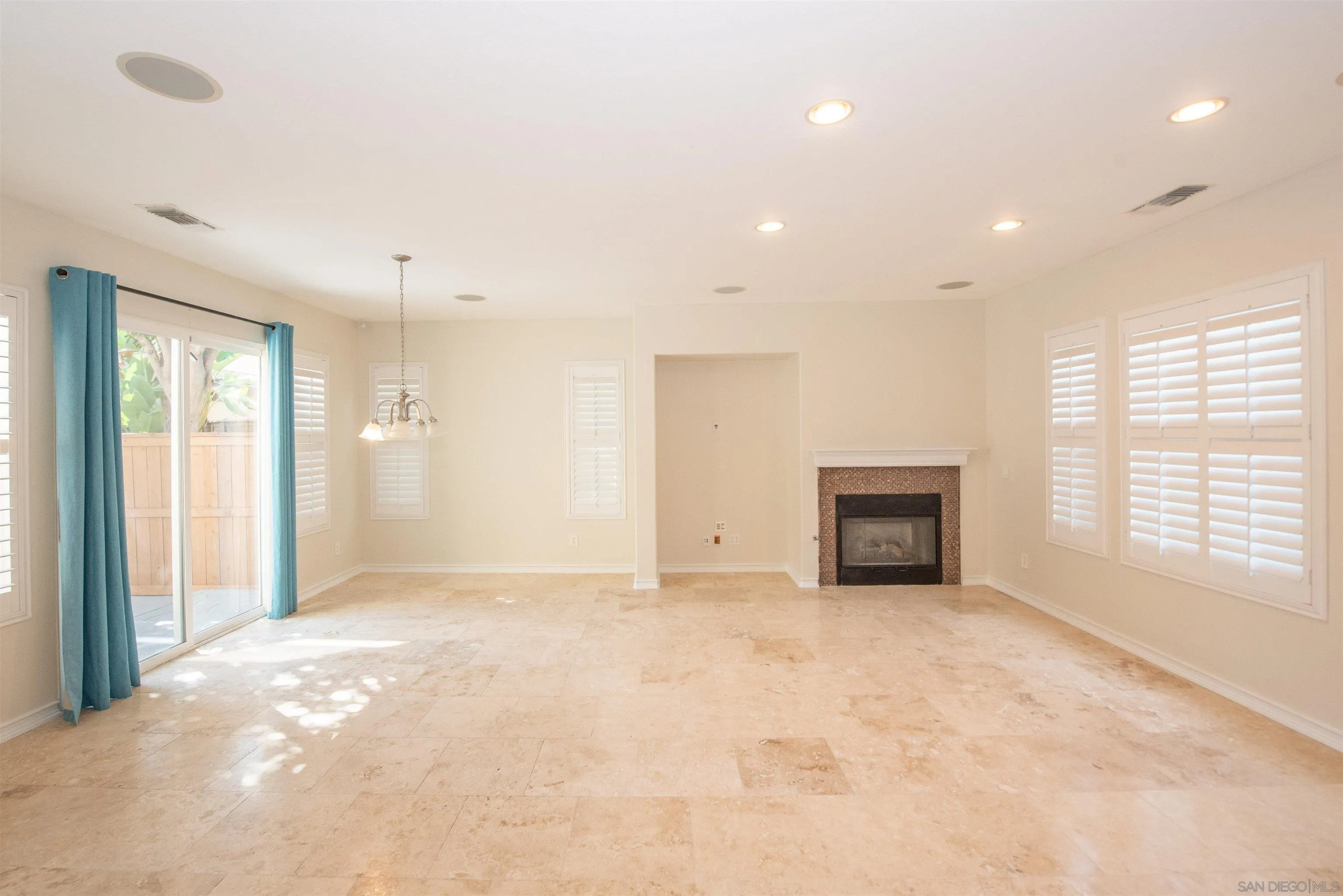 1602 Saddle Ridge Drive Chula Vista, CA 91915 - Photo 4 of 34 a view of an empty room with a fireplace and a window