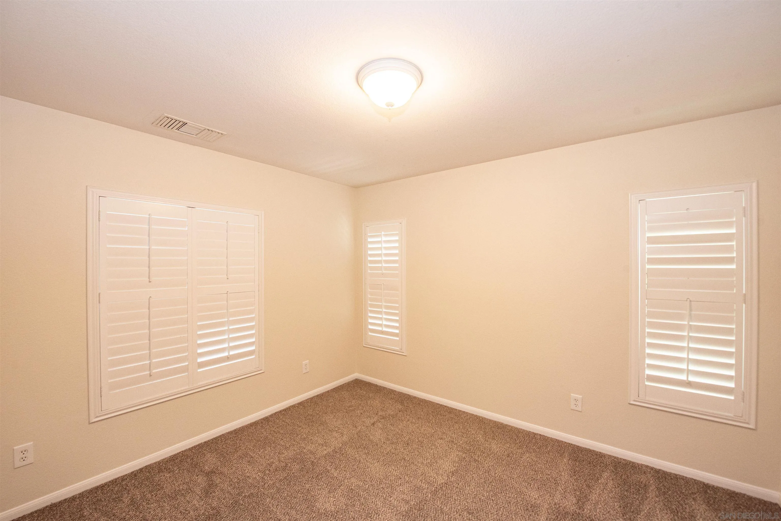 1602 Saddle Ridge Drive Chula Vista, CA 91915 - Photo 7 of 34 an empty room with windows