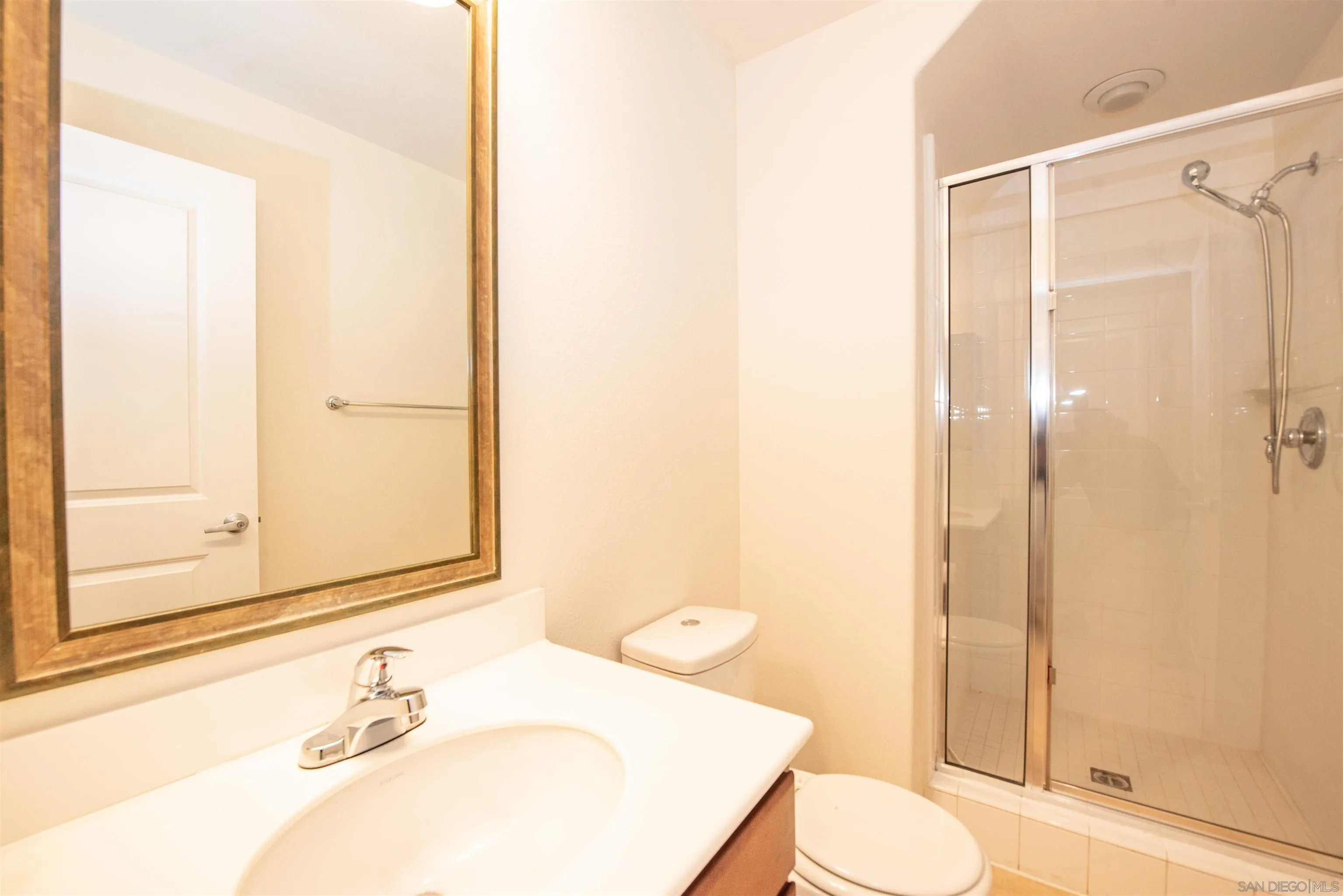 1602 Saddle Ridge Drive Chula Vista, CA 91915 - Photo 8 of 34 a bathroom with a sink and a mirror