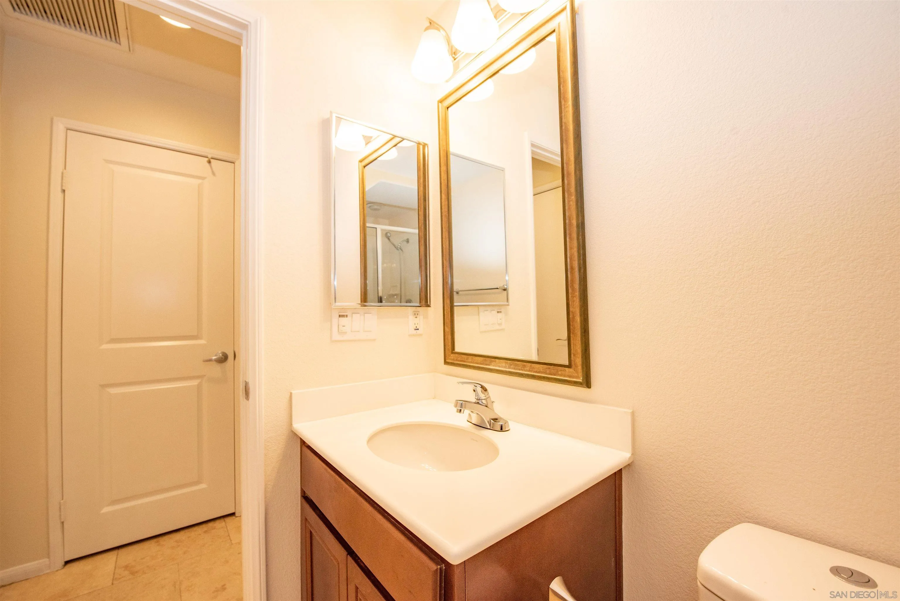 1602 Saddle Ridge Drive Chula Vista, CA 91915 - Photo 9 of 34 a bathroom with a sink toilet and vanity