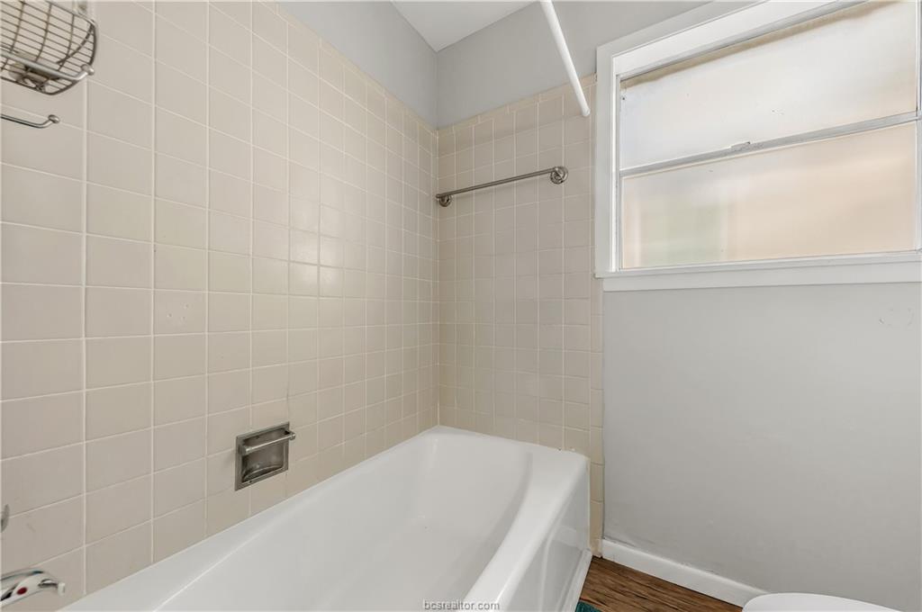 109 Sulphur Springs Road Bryan, TX 77801 - Photo 12 of 15 a bathroom with a bathtub