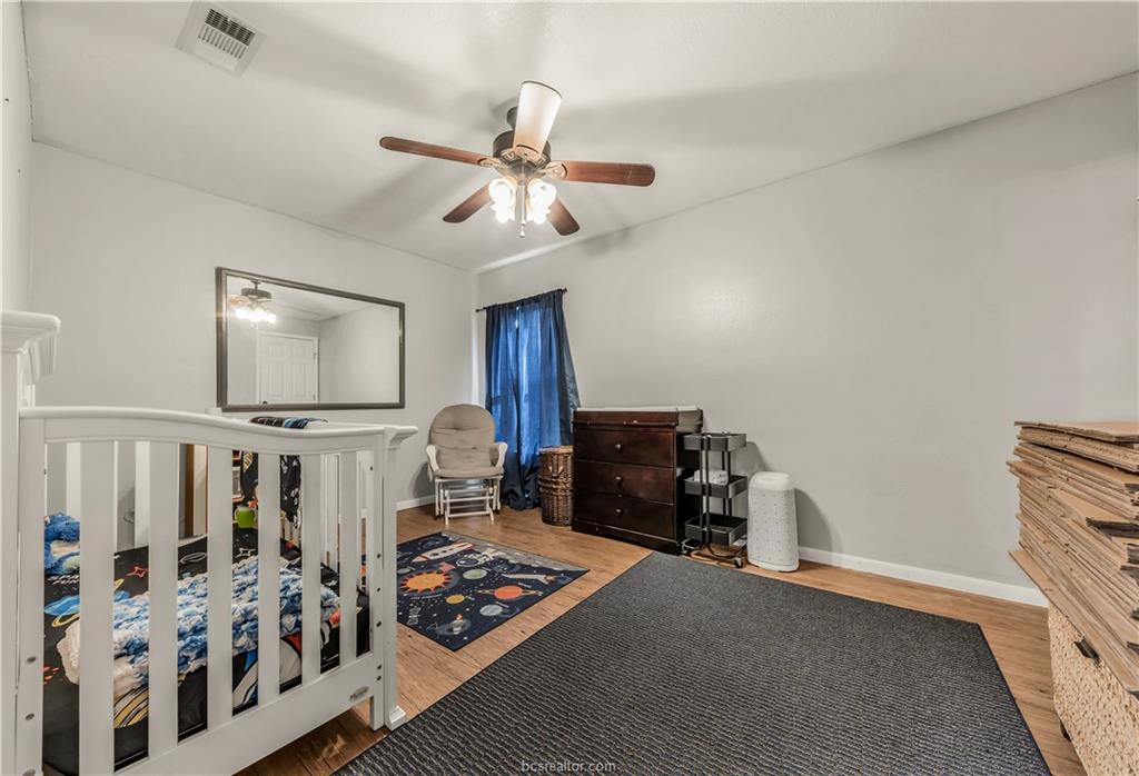 109 Sulphur Springs Road Bryan, TX 77801 - Photo 13 of 15 a living room with furniture and a flat screen tv