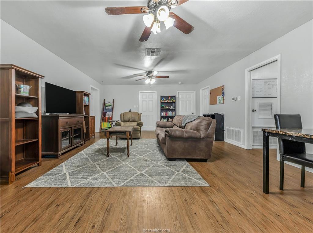 109 Sulphur Springs Road Bryan, TX 77801 - Photo 2 of 15 a living room with furniture and a flat screen tv