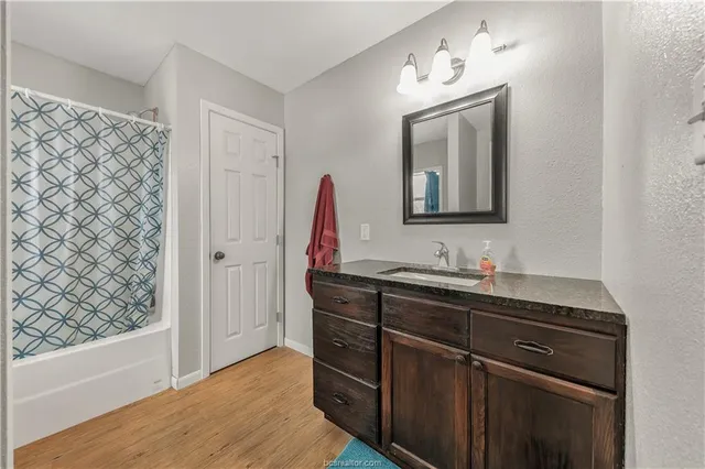 a bathroom with a sink and a mirror