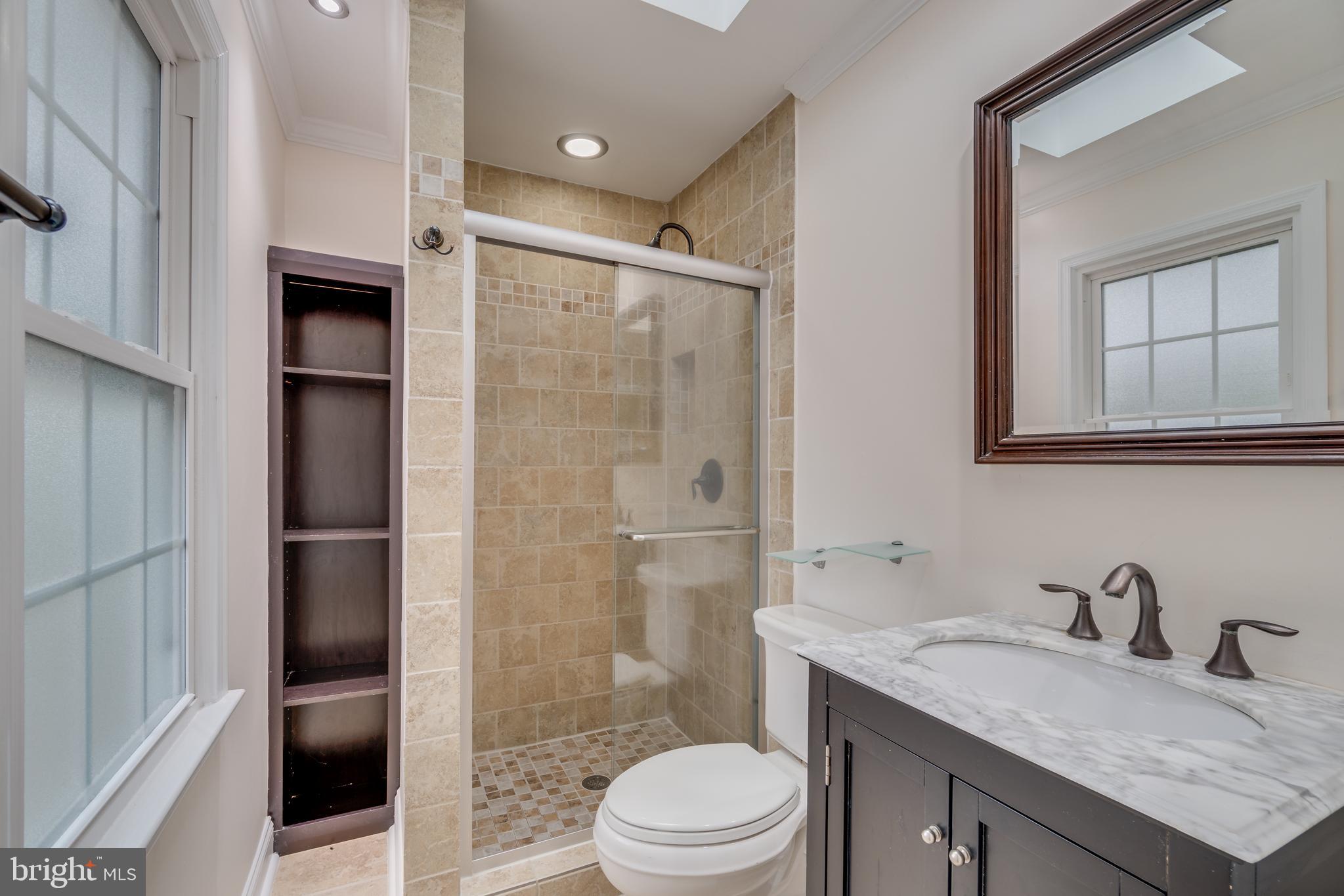 2069 Cobblestone Lane Reston, VA 20191 - Photo 17 of 35 a bathroom with a granite countertop sink toilet and shower