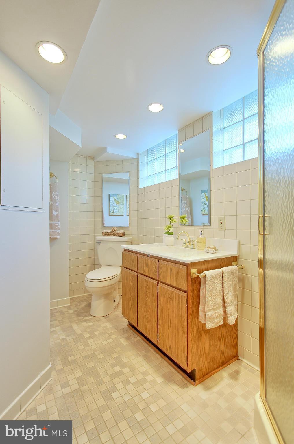 5408 Montgomery Street Springfield, VA 22151 - Photo 20 of 30 a bathroom with a sink a toilet and shower