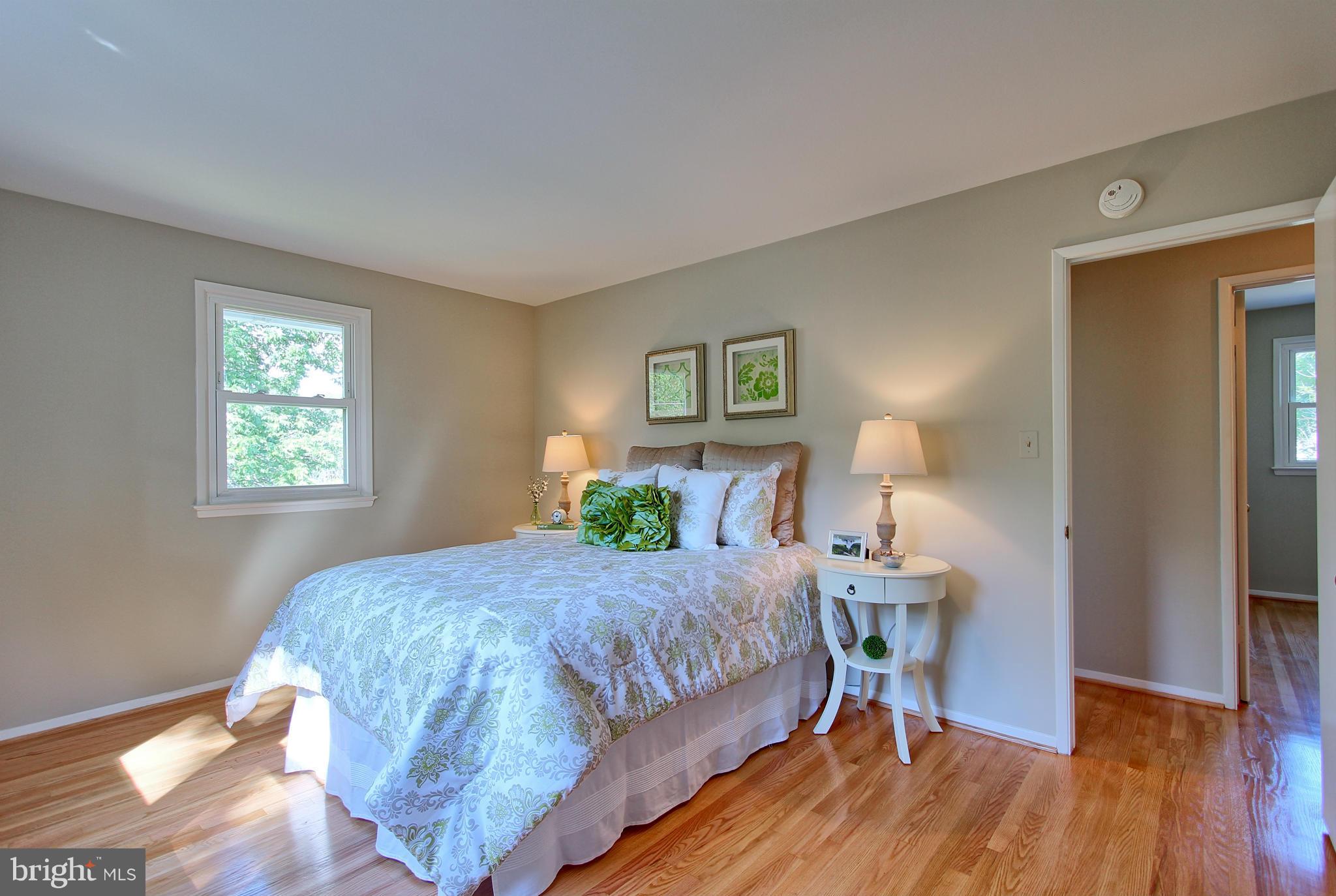 5408 Montgomery Street Springfield, VA 22151 - Photo 22 of 30 a bedroom with a bed table and a window