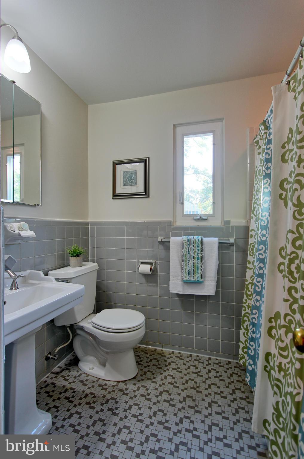 5408 Montgomery Street Springfield, VA 22151 - Photo 24 of 30 a bathroom with a toilet a sink and a shower