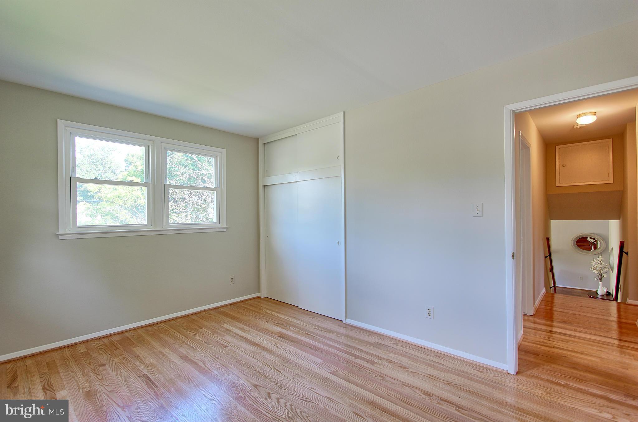5408 Montgomery Street Springfield, VA 22151 - Photo 25 of 30 an empty room with wooden floor and a window