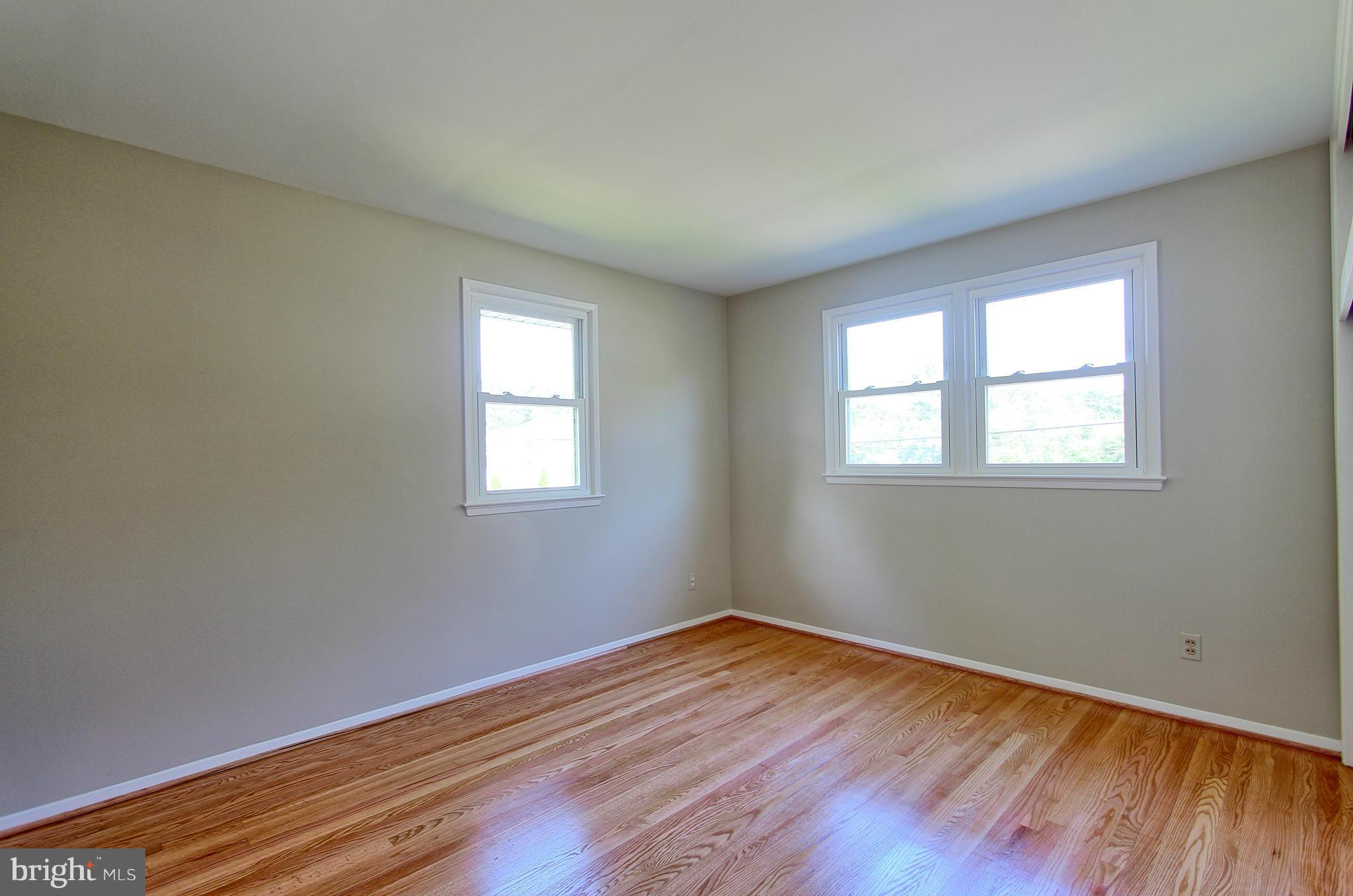 5408 Montgomery Street Springfield, VA 22151 - Photo 26 of 30 a view of empty room with wooden floor and fan