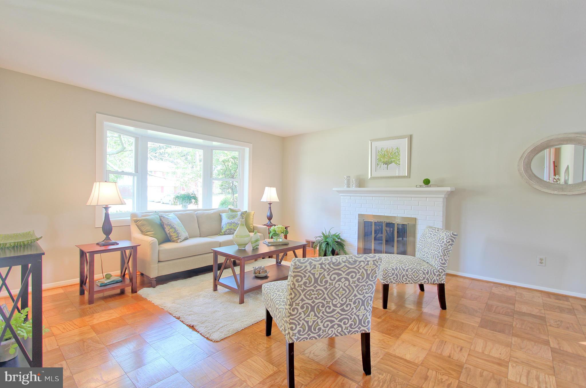 5408 Montgomery Street Springfield, VA 22151 - Photo 6 of 30 a living room with furniture and a fireplace